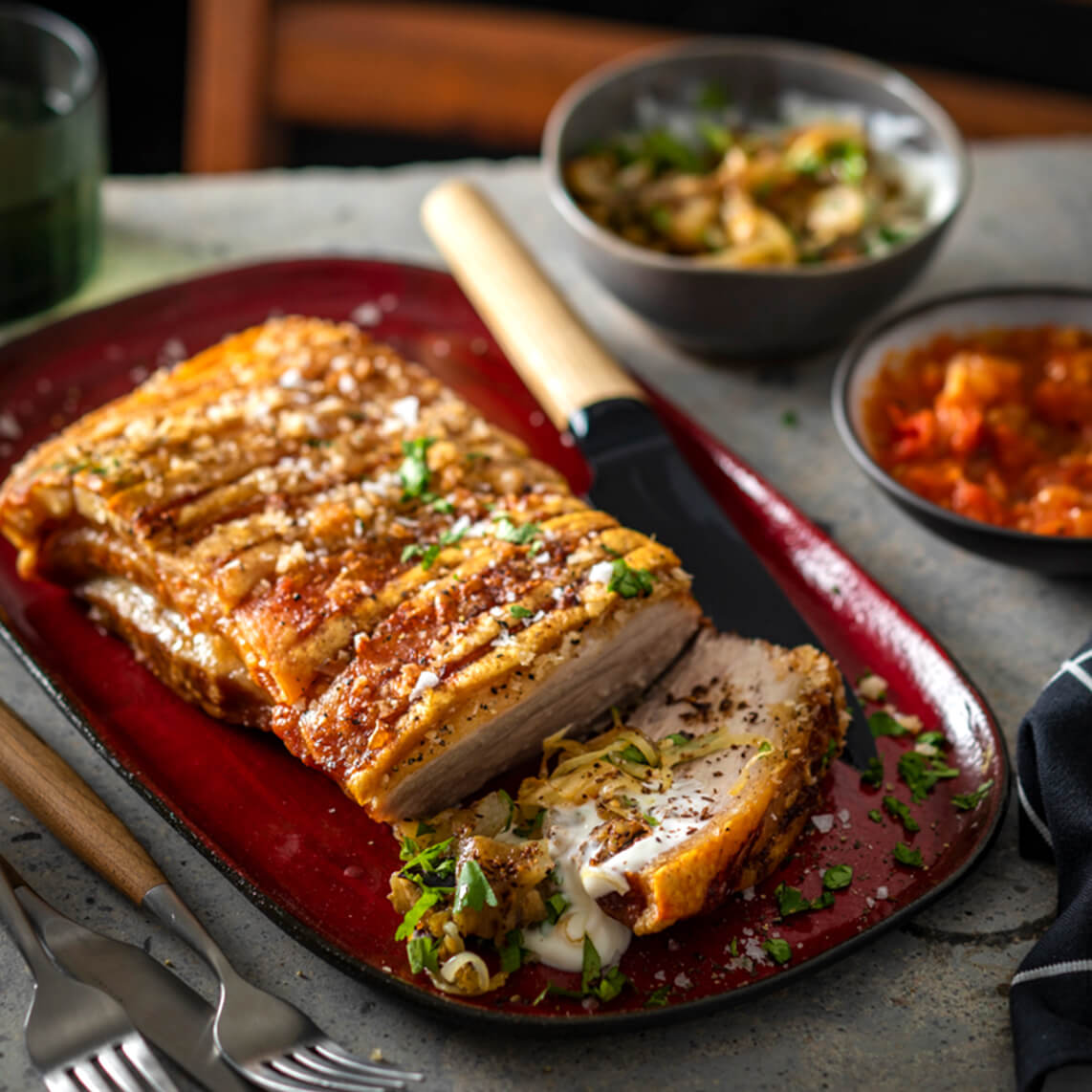 Slow-roasted pork belly with smoky brinjal salad