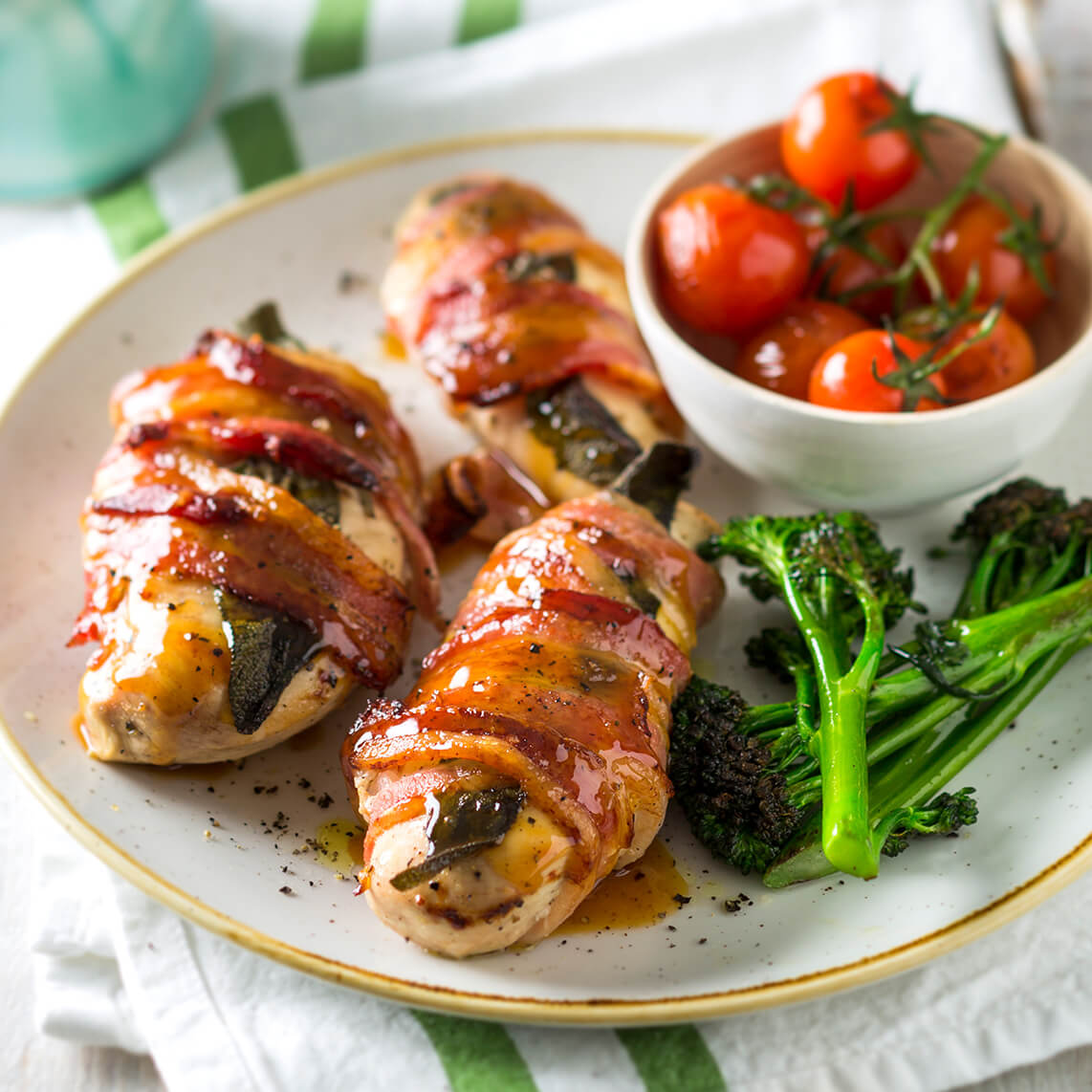 Cider-roasted chicken breasts wrapped in bacon