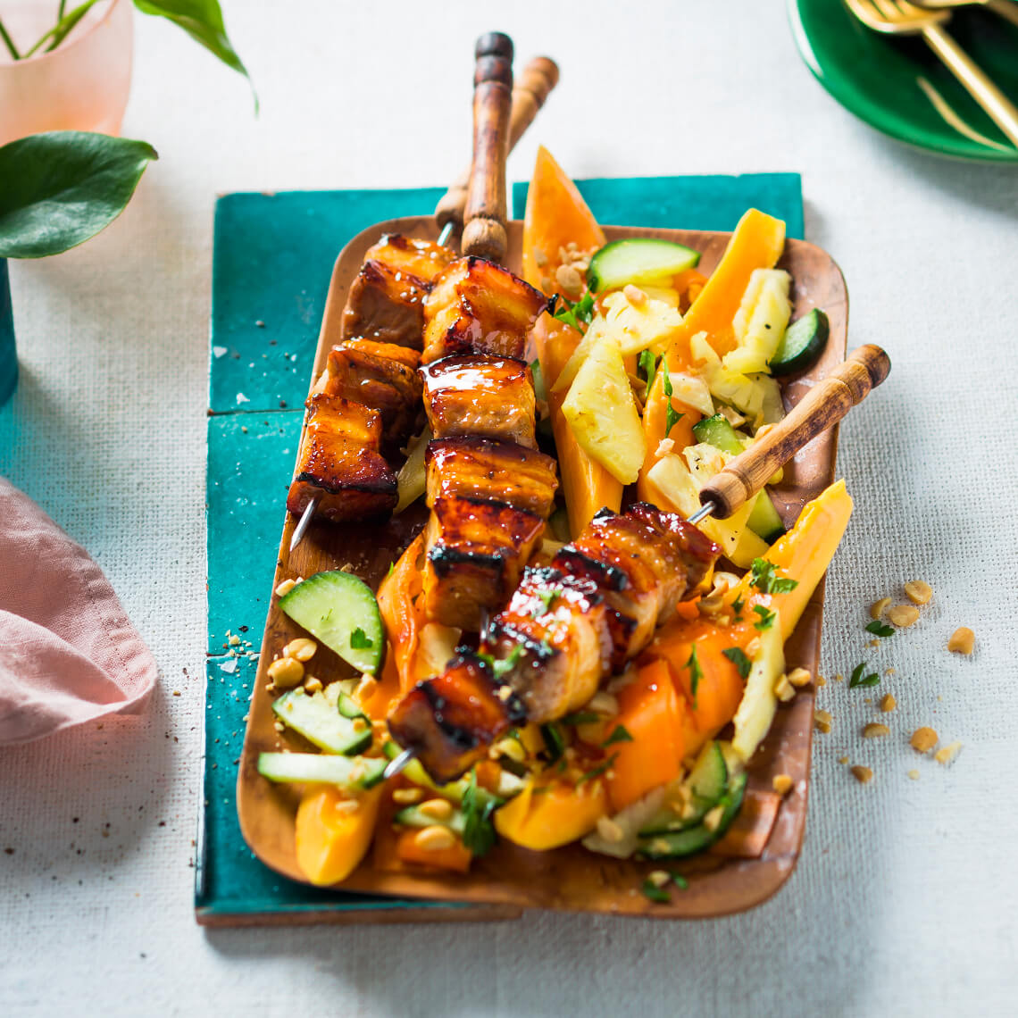 Pork belly skewers on papaya and pineapple salad Recipes Pick n Pay