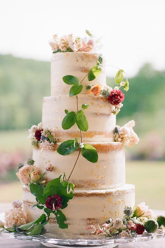 White Elevated Naked Cake with flowers