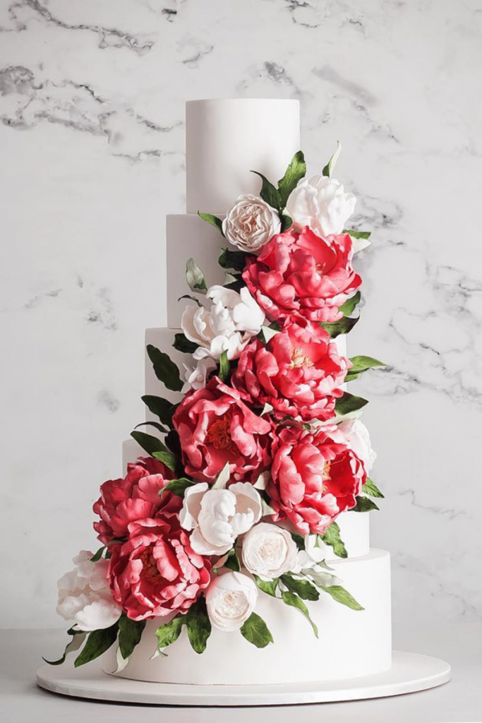 White Wedding Cake with Floral Arrangements