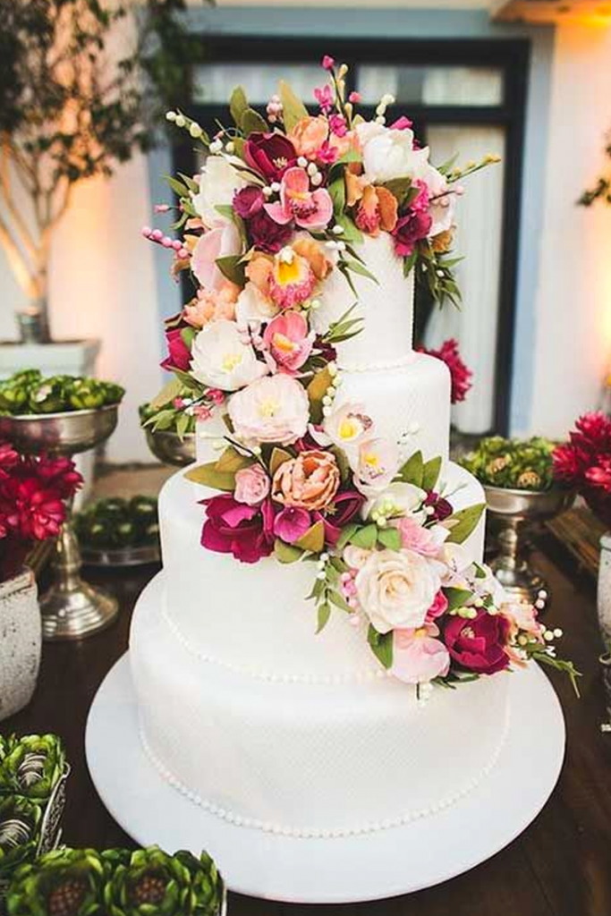 White Wedding Cake with Floral Arrangements