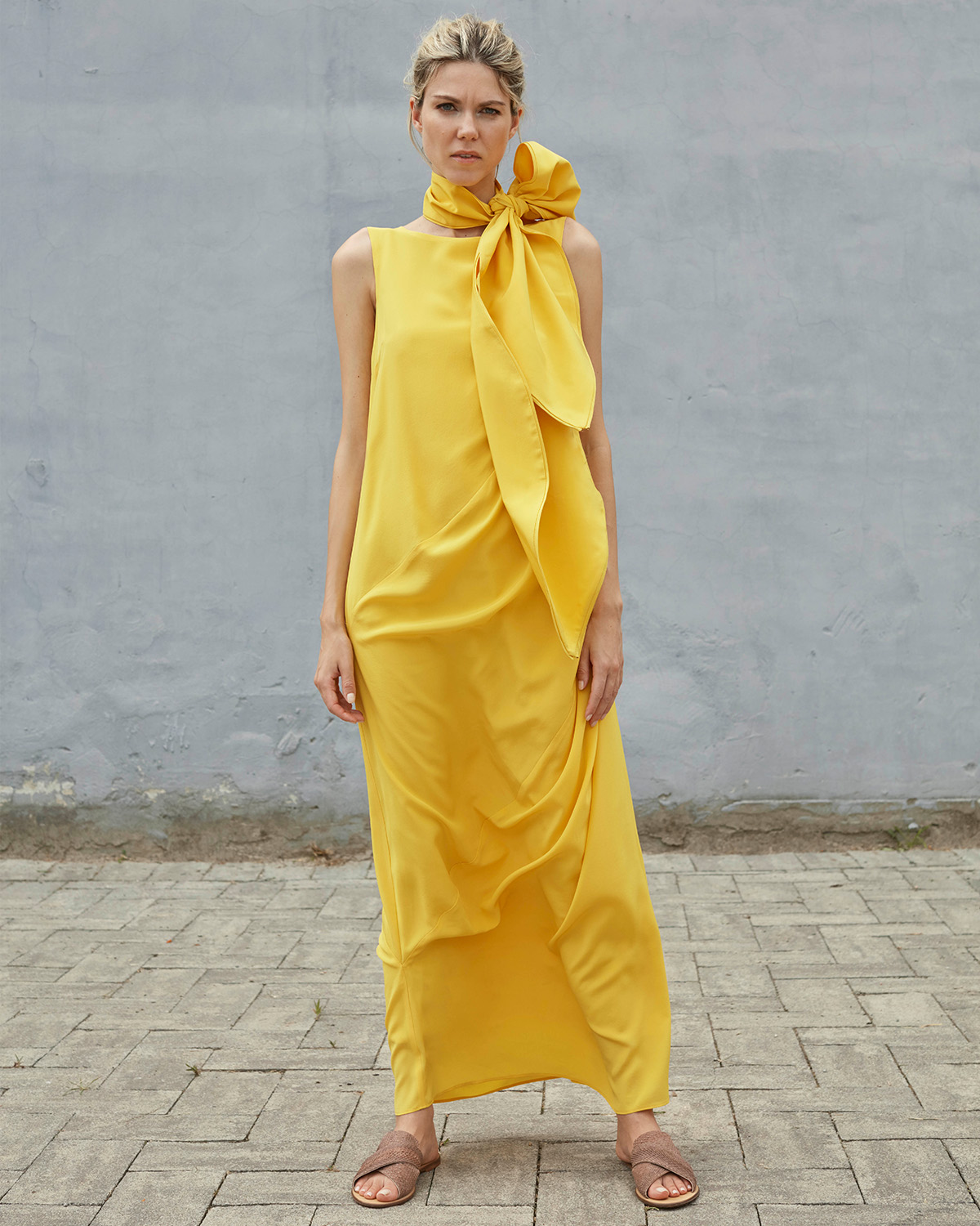 Bav Tailor wearing yellow Shakti dress