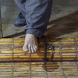 Rolling felt in a reed mat