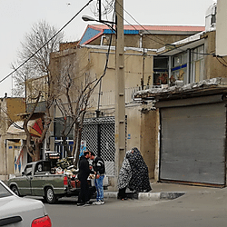 Neighbour's greeting while buying vegetables from a street vender in Moradab Hill, an informal settlement in Iran