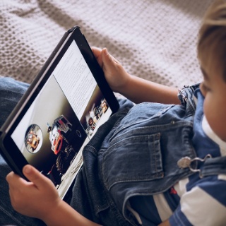 Photograph: Child reading from ipad