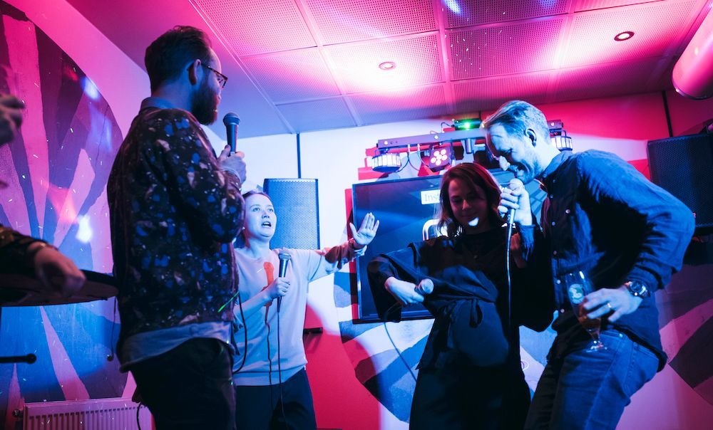 Customers singing karaoke at a karaoke room at SING SING in Sweden