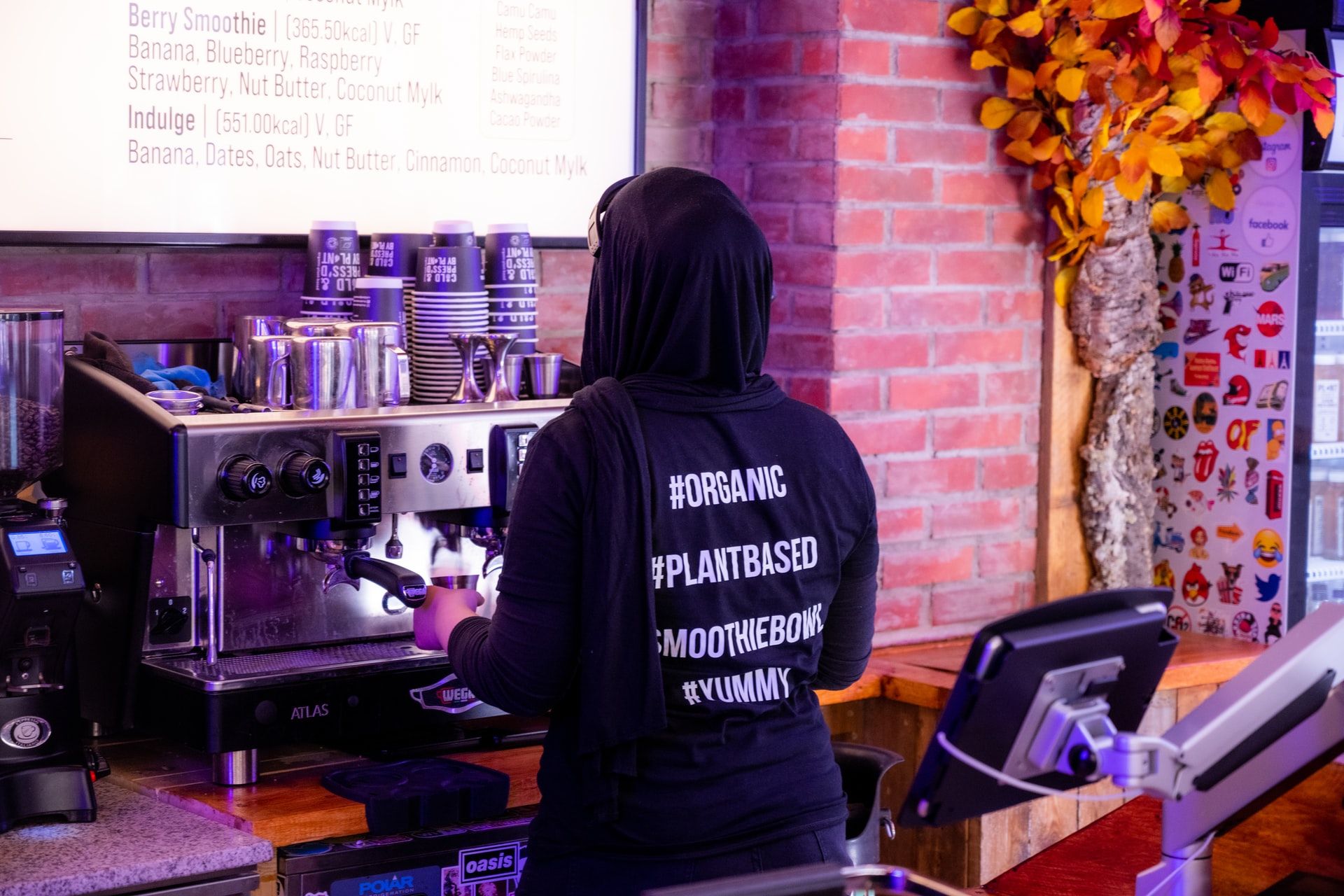 Barista making coffee at organic restaurant.