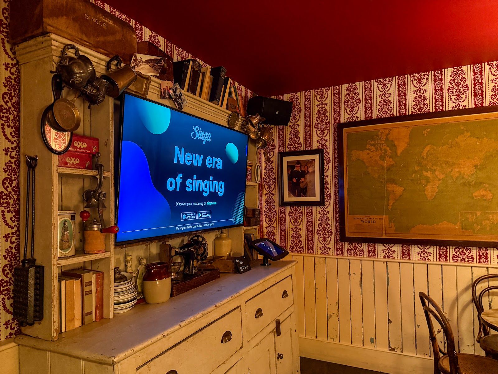 Guinan's — one of the three private singing rooms at Molly Mc's, with salvaged wallpaper and wood panelling