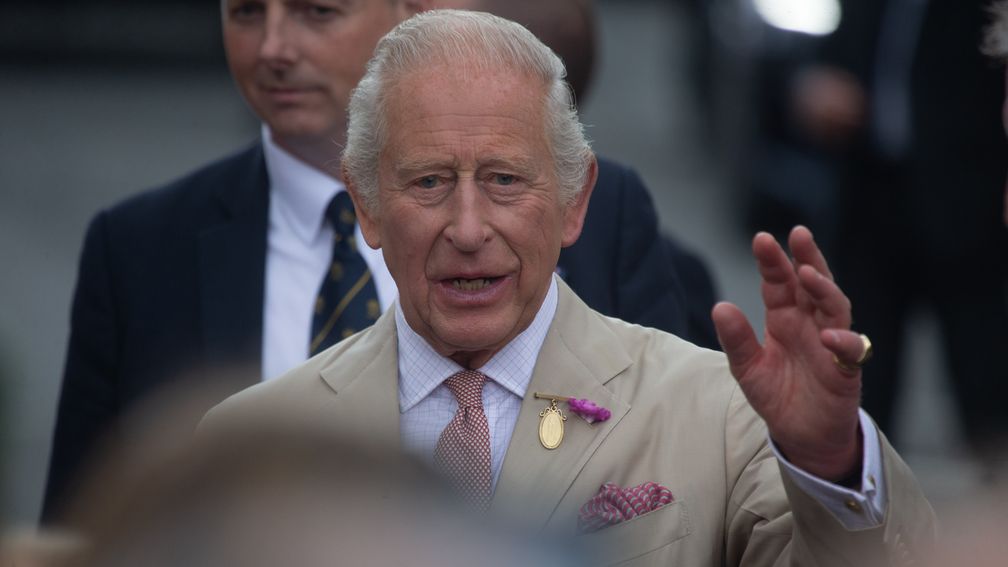 The King waves to the crowds in Newmarket
