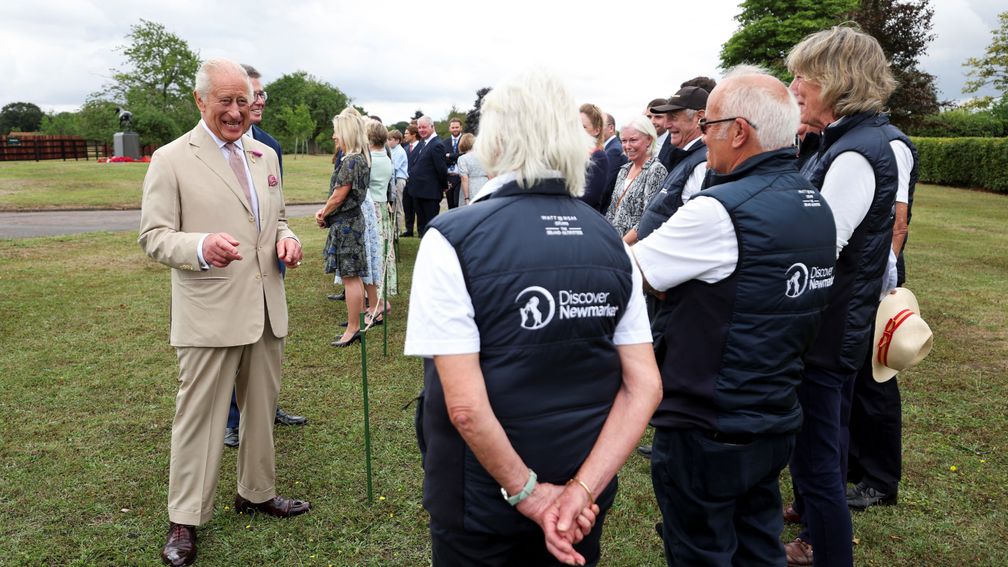 The King talks to staff members at the National Stud
