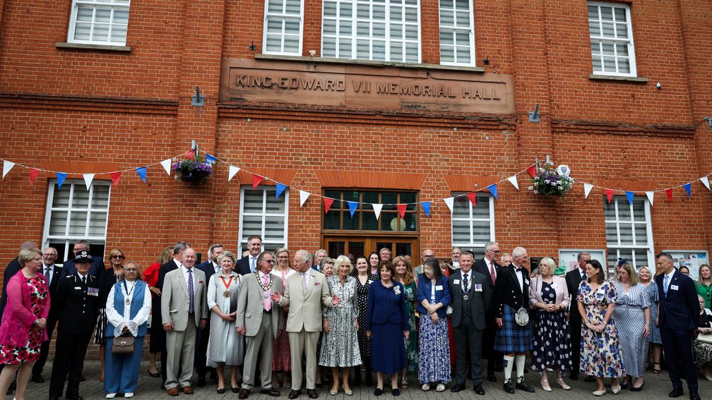 The King and Queen outside King Edward VII Memorial Hall with local officials