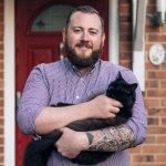 Dean holding his cat