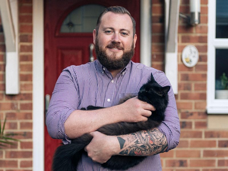 Dean holding his cat