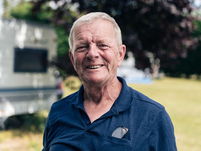 David smiling with caravan in the background