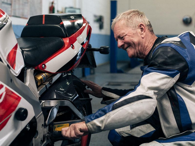 David in the garage with his motorbike