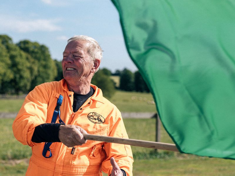 Man waving racing flag