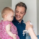 Andrew holding baby