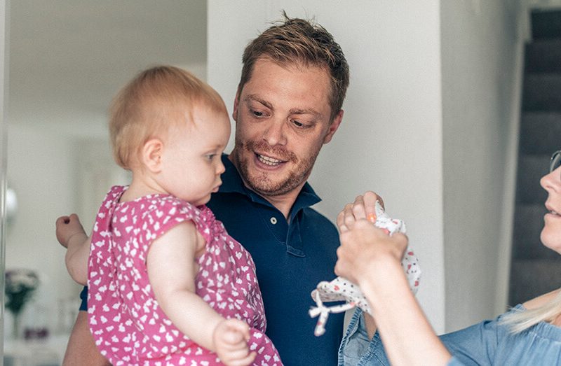 Andrew holding baby