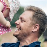 Andrew lifting up his kid