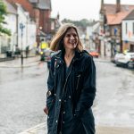 Woman smiling while walking on high street