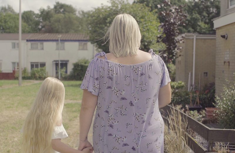 Suzie walking away with daughter