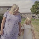 Suzie walking towards camera with daughter