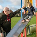 Martin with his daughter on a slide