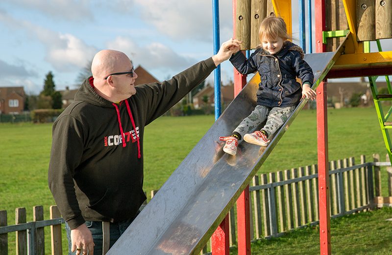 Martin with his daughter on a slide