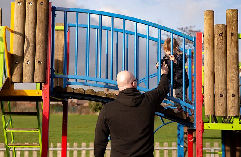 Martin at a play area with daughter
