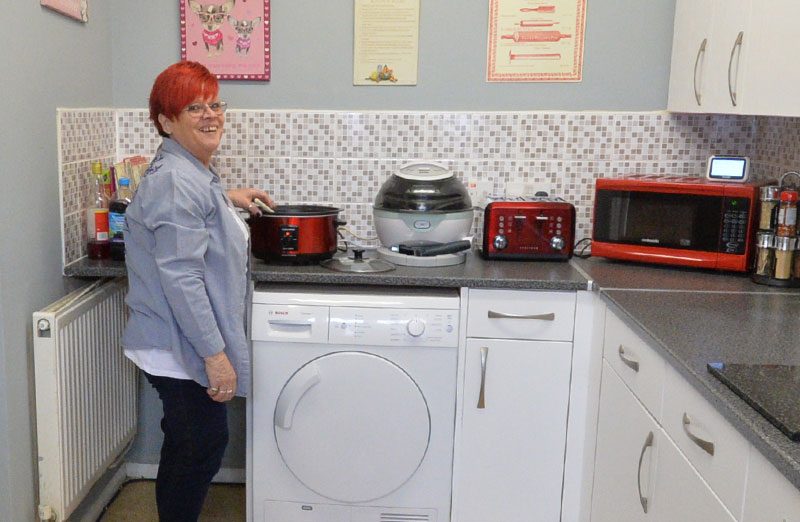 Sue in her kitchen