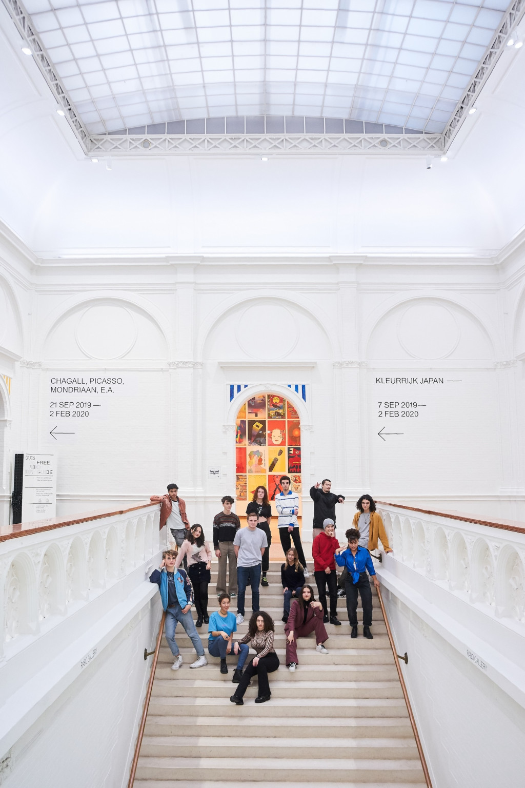 photo of blikopeners on the historical staircase at the Stedelijk