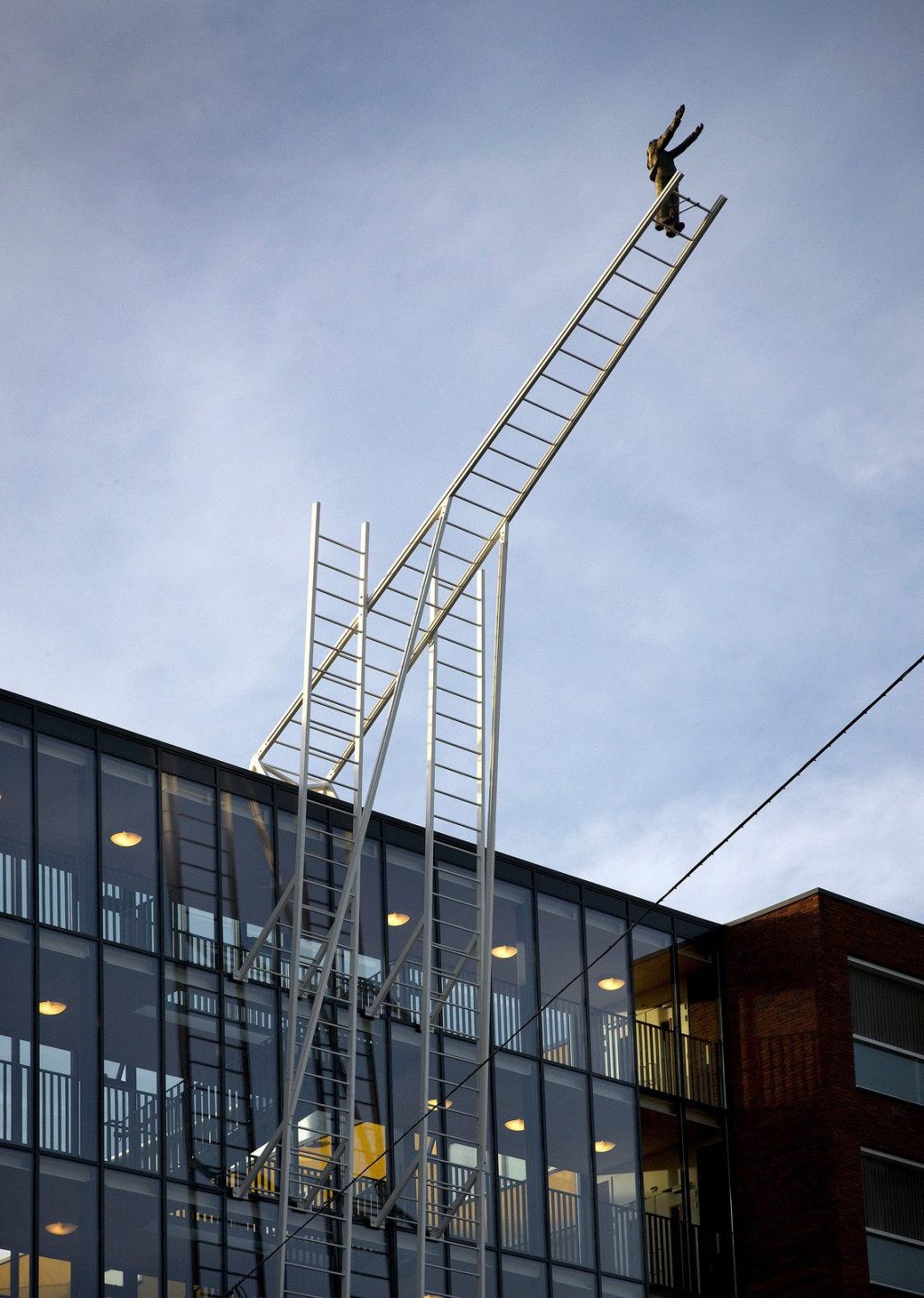 artwork, person on stairs to building, amsterdam
