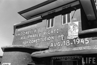 the poster Boeng Ajo Boeng hanging on a building in Jakarta. (Photo: John Florea/LIFE)