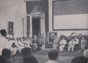 Sukarno and Hatta commemorating Independence Day, 17 August 1947, at the Yogyakarta Presidential Palace. Ki Hajar Dewantara, as the leader of this ceremony, is giving a speech (Photo: Lukisan Revolusi Rakjat Indonesia, 1945–1949).