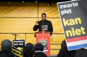 Fig. 5 Anti-Zwarte Piet activist Jerry Afriyie during a demonstration of action group 'Kick Out Zwarte Piet' at the entrance of Ahoy © ANP.