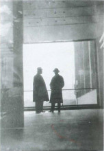 UNOVIS in Vitebsk, 1921. In the foreground with a black square on his sleeve Nikolai Suetin Behind, next to the black board: Kazimir Malevich.