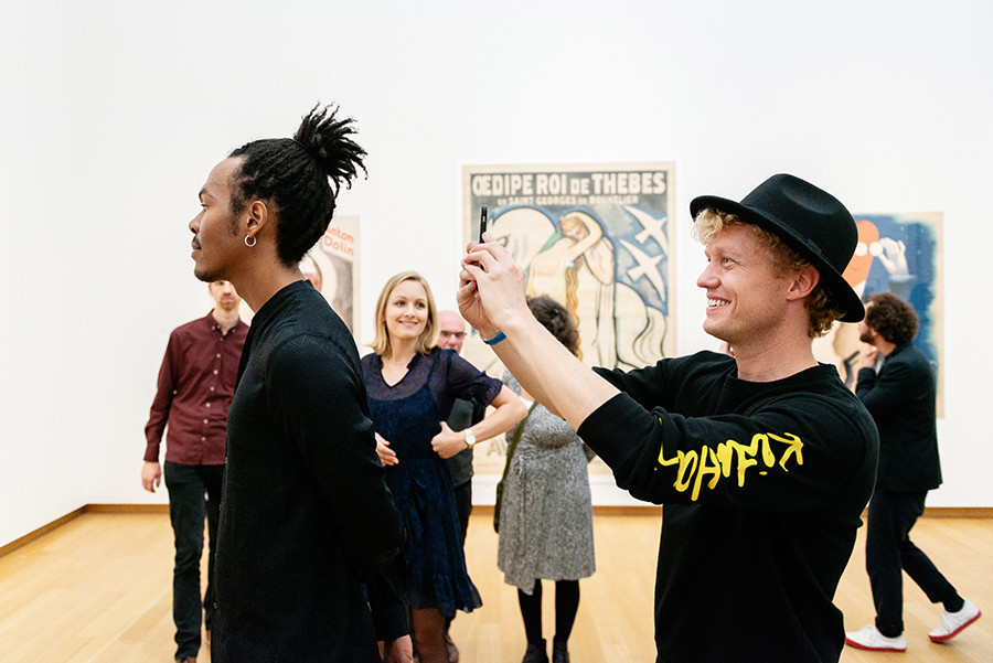 Visitors at the opening. Partly visible, works by Charles Kiffer, Kees van Dongen, and Jean Carlu. Photo: LNDW Studio.