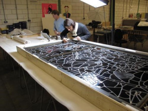 Lisya Bicaci is consolidating cracks in a stained-glass window by Joep Nicolas