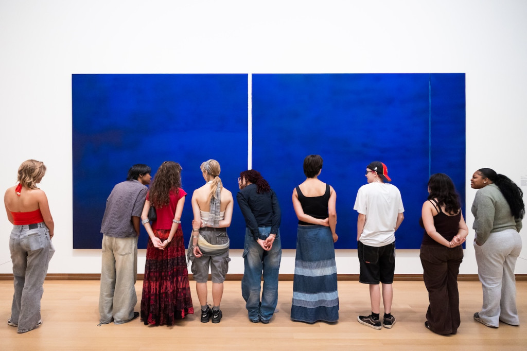 photo of childeren looking at artwork