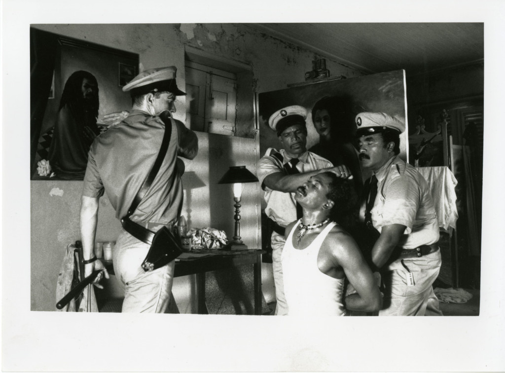 a black man being arrested by policemen 
