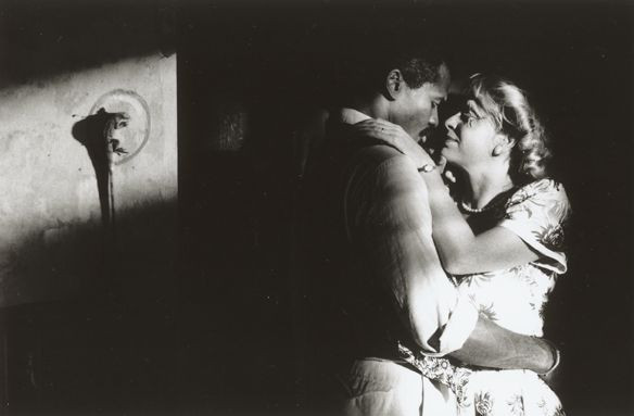 a woman and a man kissing