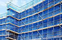 Temporary works coordinator courses - building with temporary scaffolding, blue