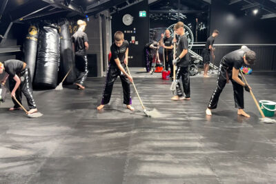 Staying humble and helpful, the team diligently cleaned up after day two of the ProKick Black Belt event on Tuesday, 16th December 2025.