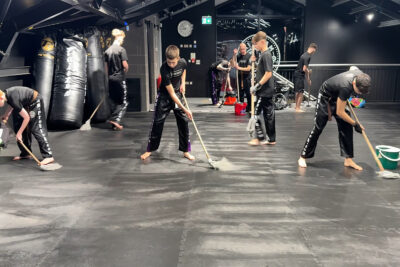 Staying humble and helpful, the team diligently cleaned up after day two of the ProKick Black Belt event on Tuesday, 16th December 2025.