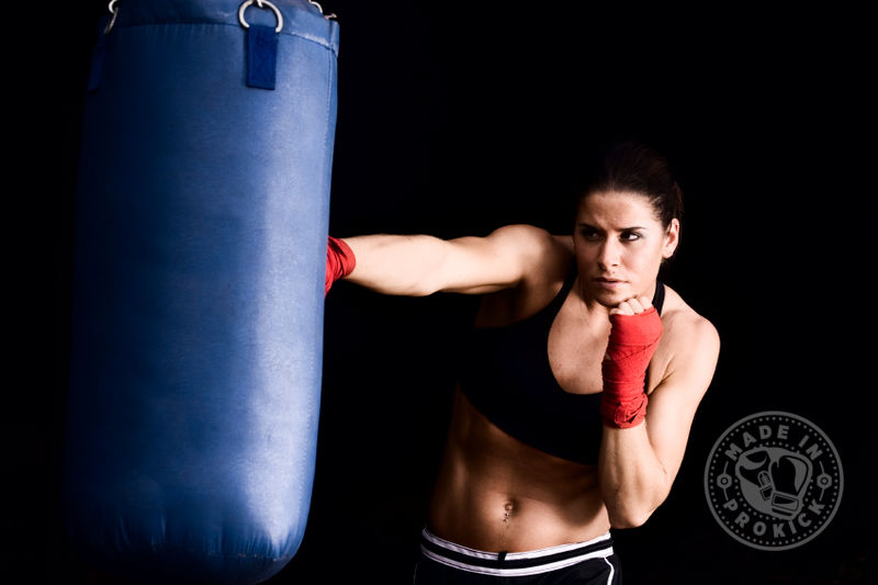 ProKick Girl training on the punching bag