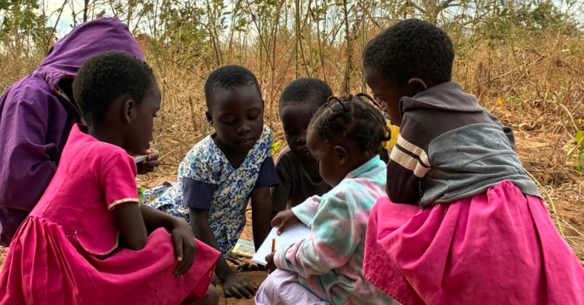 children in malawi writing