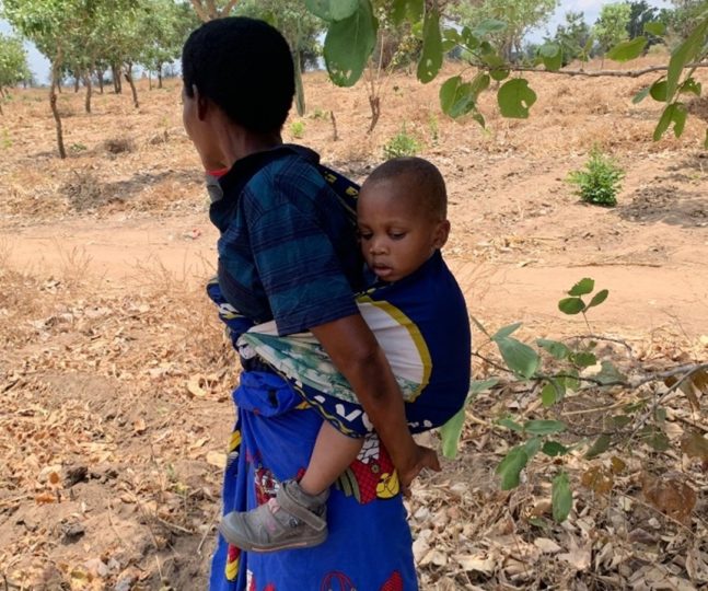 Janatu on grandmother's back