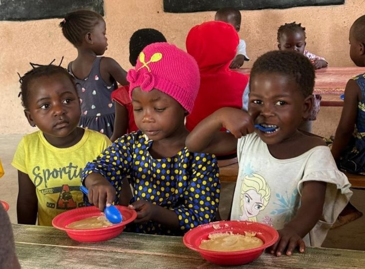 Nursery students eating their porridge