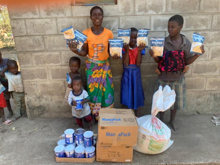 A faily in Malawi show their delivery of nutritional supplies